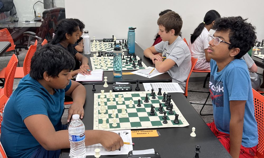 CHESSKLUB students competing in a chess tournament