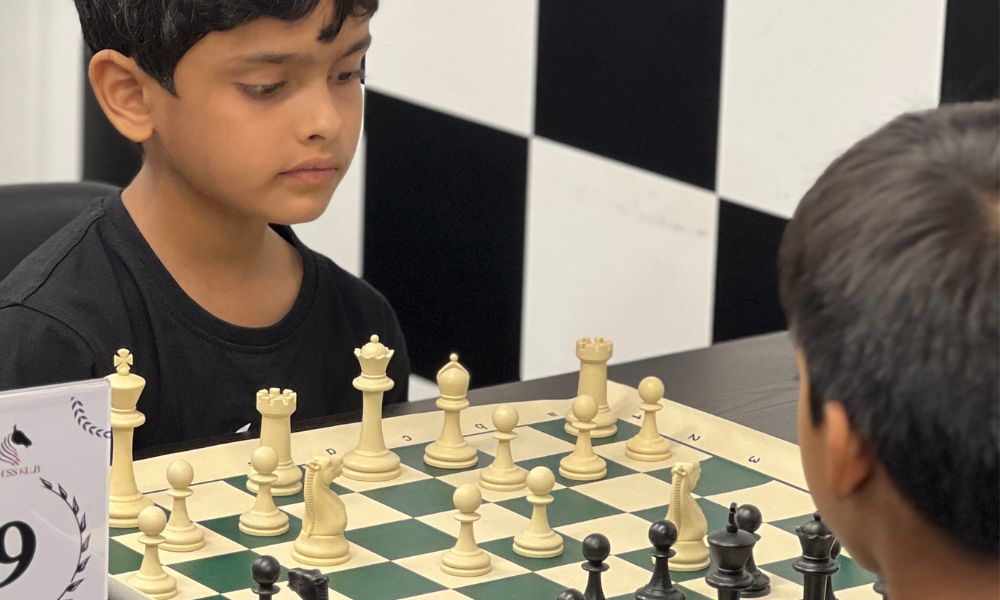 CHESSKLUB student practicing his strategy by playing chess