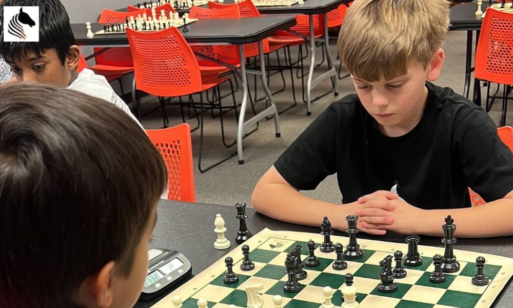 CHESSKLUB students in deep thought during a complex chess game