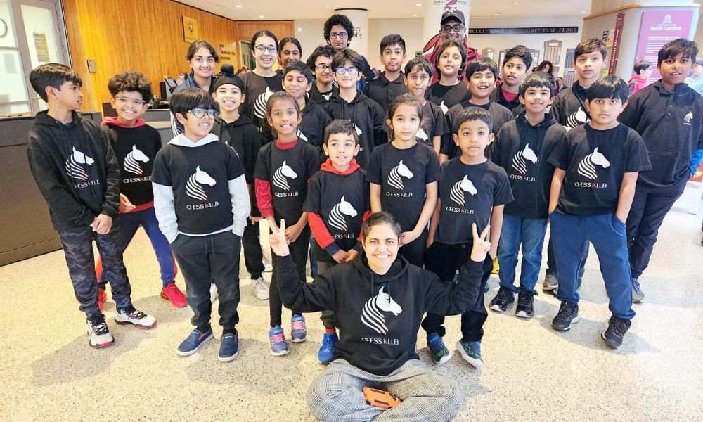 The CHESSKLUB team of young players and their Coach