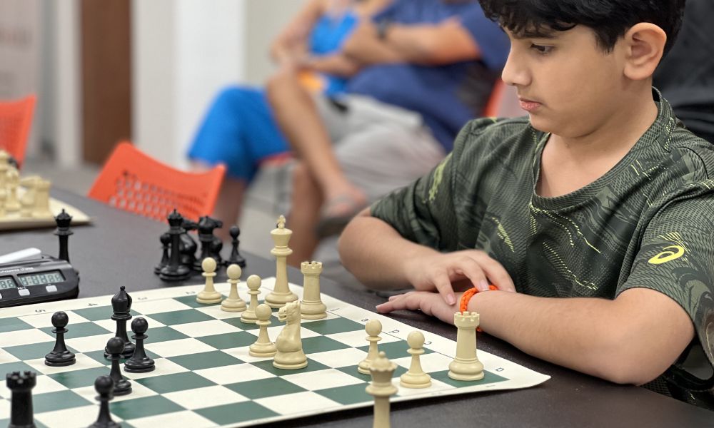 CHESSKLUB student participating in a competitive chess game