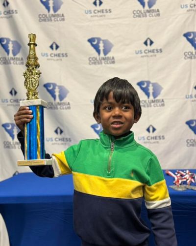 CHESS KLUB Student with Trophy