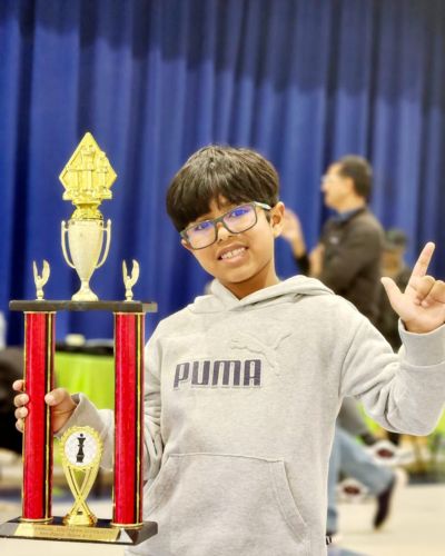 CHESS KLUB Student with Trophy