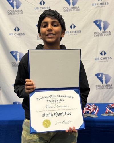 CHESS KLUB Student with Trophy