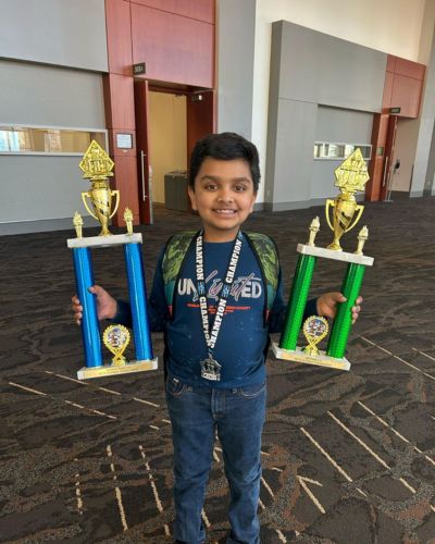 CHESS KLUB Student with Trophy