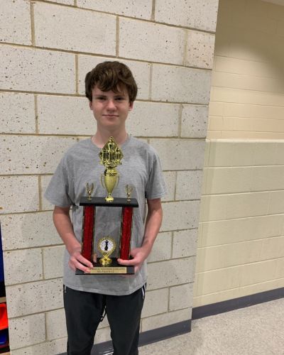 CHESS KLUB Student with Trophy