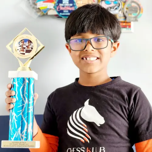 CHESS KLUB student with trophy