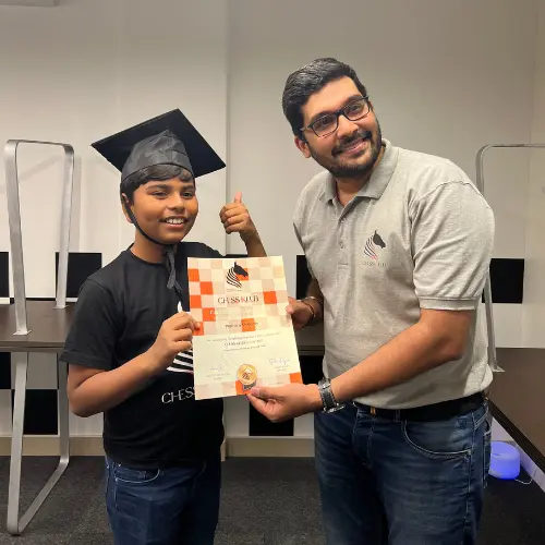 CHESS KLUB Coach awarding a trophy to a student
